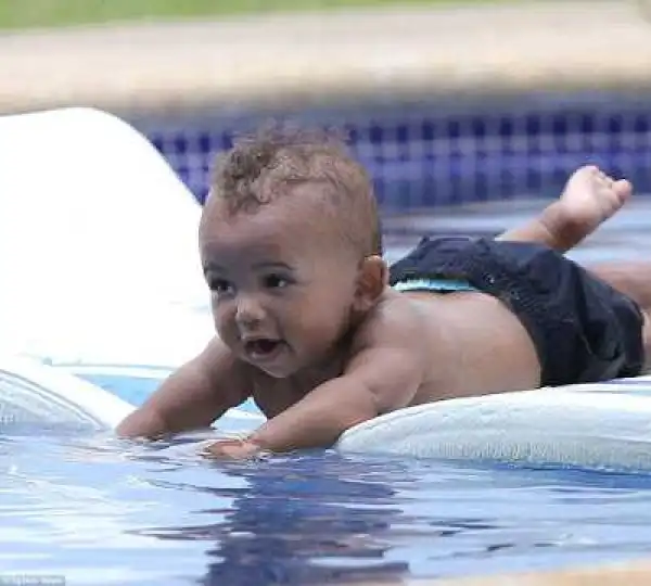 These new photos of North and Saint West enjoying pool time with Kim are too cute for words